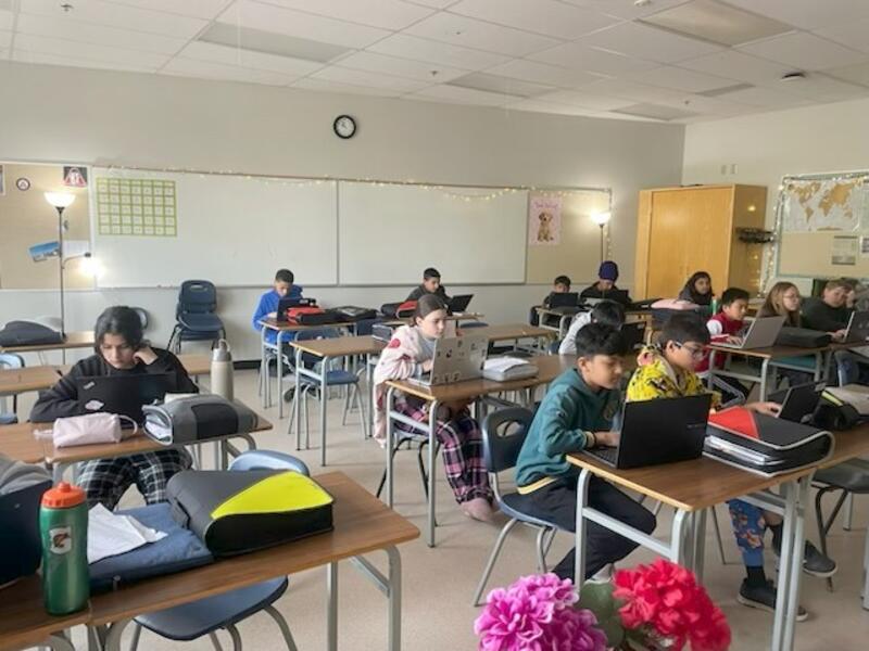 Grade 6 students working on persuasive essays.